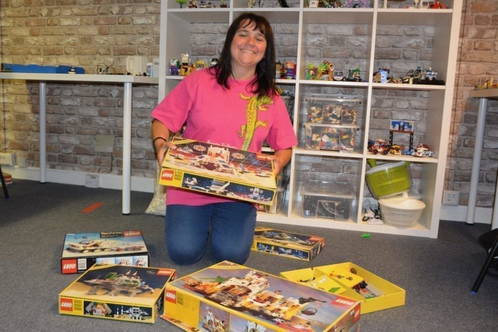 Lego Donations needed for Pure Bricks Studio! 5 Female Pure client surround by boxes of donated Lego