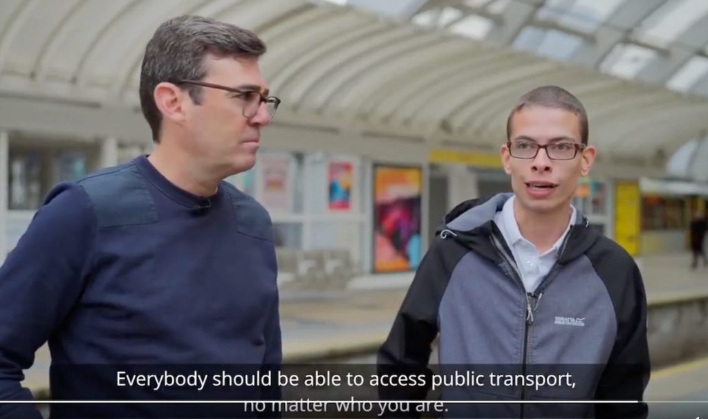 Andy Burnham & Nathaniel on Transport Accessibility 1 Andy and Nathaniel on train platform with subtitle 'Everybody should be able to access public transport, no matter who you are.
