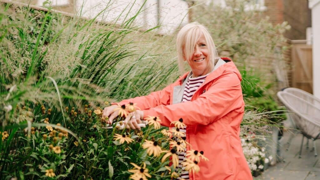 Health & Wellbeing 2 Woman smiling and gardening