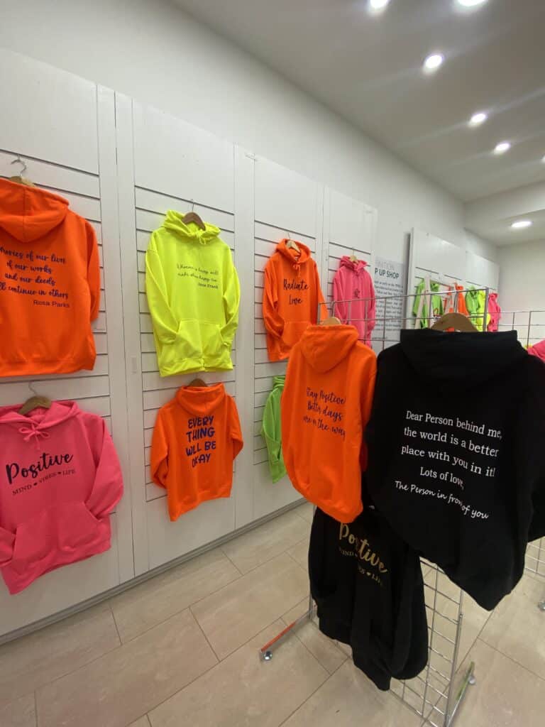 Pure Pop-Up Returns at Stockport Merseyway 6 Hoodies on a wall